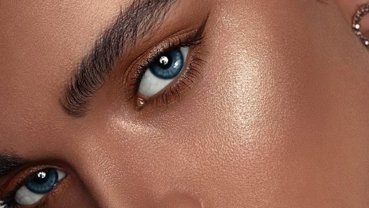 woman with red lipstick and gold hoop earrings