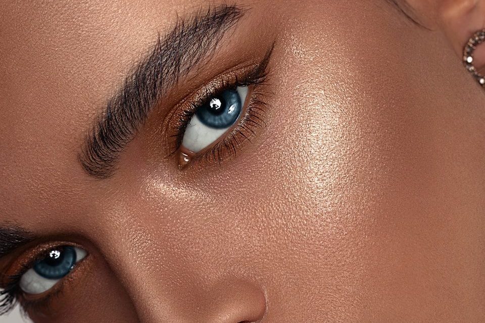 woman with red lipstick and gold hoop earrings