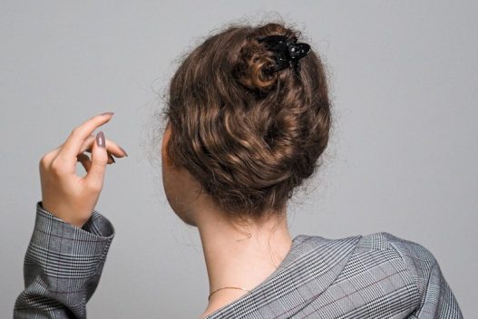 woman in gray and white striped long sleeve shirt