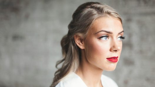 woman wearing white shirt with red lipstick