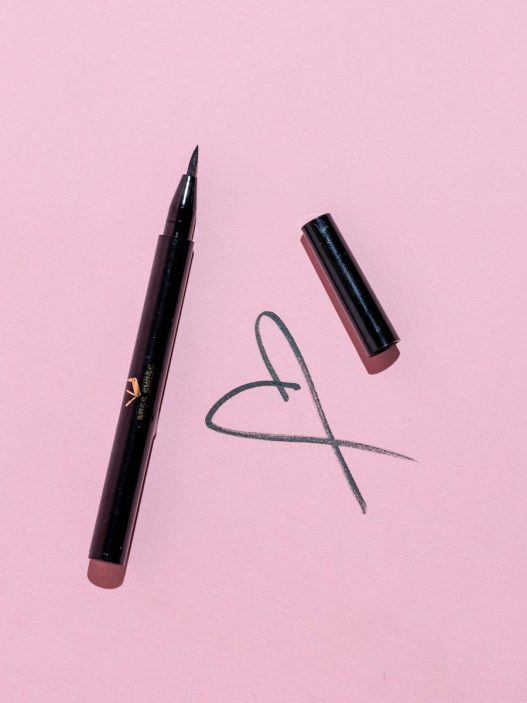 black pen and black framed eyeglasses