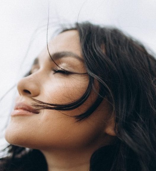 woman in black shirt wearing eyeglasses